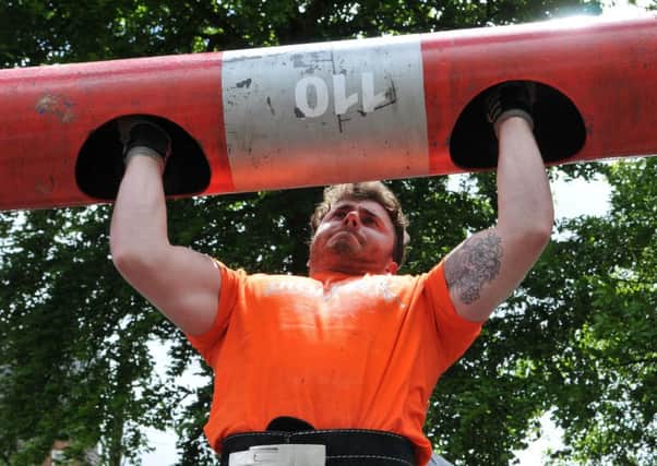 Taking the strain during the strongman competition held as part of the Knockloughrim Primary School family fun day.INMM2315-395