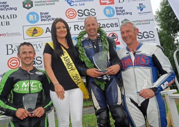 Pictured (left to right): David Howard, Runner Up, Carly Black, Miss Armoy 2014, Ian Morrell, Winner and Vic Allan, who took third place, pictured after the SS400CC/MOTO 450CC