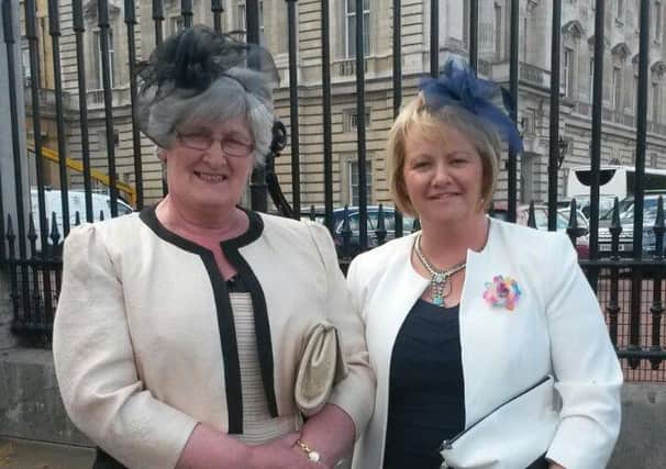 Margaret Gurney from Ballymena (left) who was awarded the B.E.M  in the Queen's New Year Honours List, is pictured with her daughter, Valerie, attending the Garden Party at Buckingham Palace last month.  Local Alzheimers Society volunteer Margaret was awarded the British Empire Medal for her services to the community in Ballymena and Antrim and received her medal at a ceremony at Hillsborough at the end of April. She  recognised for her outstanding work and commitment to help raise awareness, funds and offering support to those who are diagnosed with dementia and Alzheimers. (Submitted Picture).