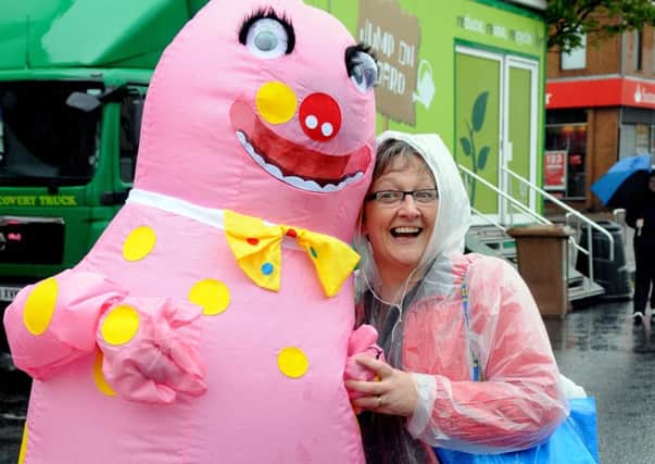 Mr. Blobby who made a welcome return for the Ulster Strongman 2012, pictured with popular Cookstown playwright Carol Doey.mm19-153ar.