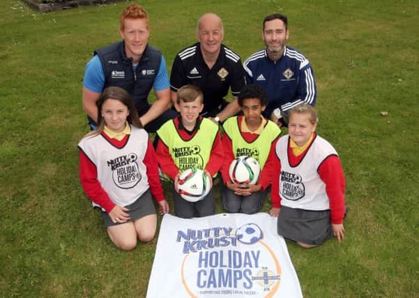 Ballykeel PS pupils Amy Simpson, Adam McFall, Lemar Manson and Chloe Stirrup, pictured along with Ally McIlroy (Active Communities Multi Sport Coach), Ian Getty (IFA Coach) and Mo McDowell (IFA Primary School Coach) at the launch of the IFA Nutty Krust coaching weeks in Ballymena. The annual events will go ahead this year as a tribute to organiser Wes Gregg, who passed away recently. INBT25-246AC