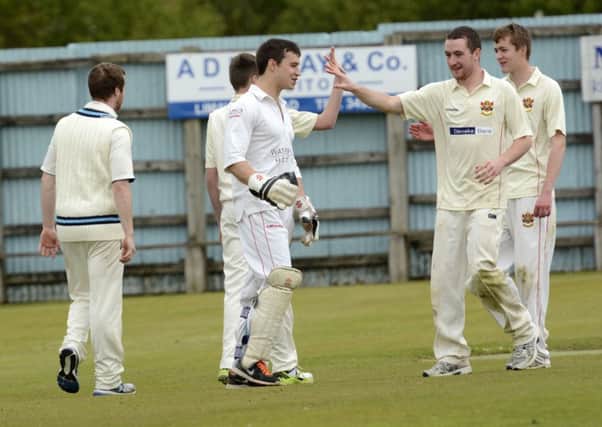 The Brigade Seconds players celebrate after taking a Coleraine II's wicket at Beechgrove on Saturday. INLS2415-166KM