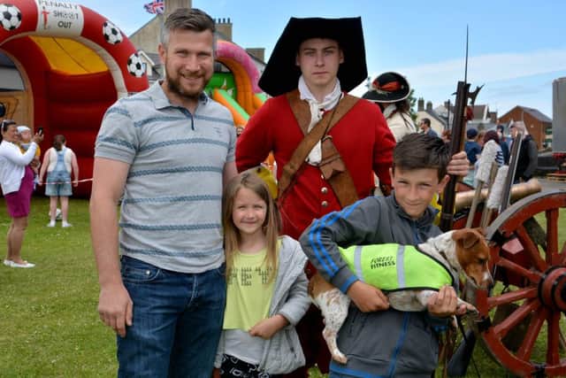 Lee, Jessica and Gavin Vaughan with dog Harvey and soldier Eoghan Donelley at the King William pageant 2015. INCT 24-097-GR