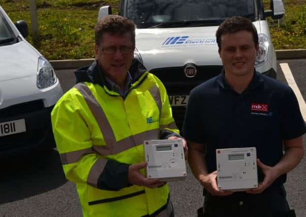 Kyle Stewart from MD Electrical with NIEs David Bell at the launch of the meter replacement project. INLT 25-657-CON