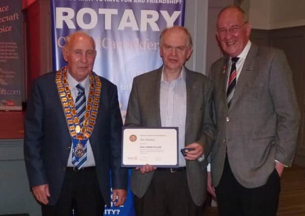 Jim Dunlop, Paul Harris Fellow  (centre) with Sam Crowe, president of Carrickfergus Rotary Cllub (left) and Phillip Beggs, Rotary District governor INCT 24-706-CON.