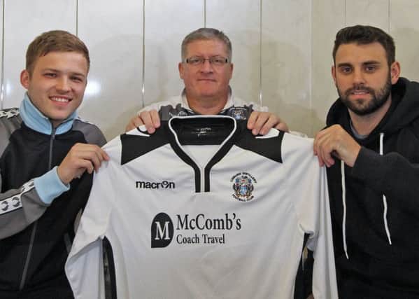 Lisburn Distillery manager Tommy Kincaid (centre) with new signings Stephen Boyd (left) and Dean Heasley. Picture - David Hunter.