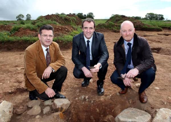 Mandatory Credit - Andrew Paton/Presseye Foundations of a house thought to belong to the Gaelic O'Hagan clan, some 700 years ago, have been uncovered by the Department of the Environment (DOE) at Tullaghoge. (LtoR) Principal Archaeologist Dr John O'Keeffe, Environment Minister Mark H Durkan and Tony McCance from Mid Ulster District Council.