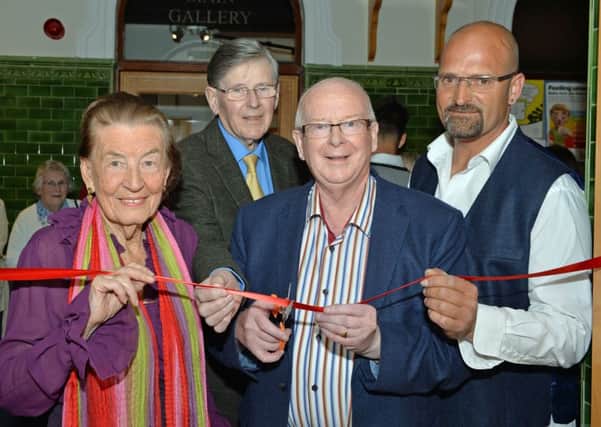 Councillor Tommy Nicholl MBE cuts the ribbon to officially open the Myth and Modern Sculpture exhibition by Miguel Frederico Neves (right) and guest artists, Pattie Barklie and Bruce McIntyre at Carnegie Arts Centre. INLT 24-045-PSB