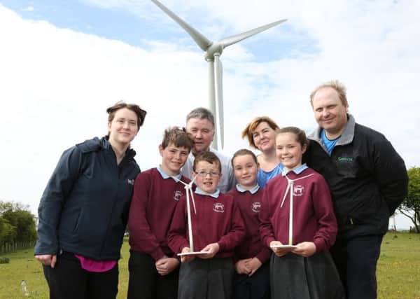 Pupils from St John's PS in Carnlough visited Carn Hill wind farm in Newtownabbey to mark Global WInd Day. Pictured are (back row) Aoife Legear, development project manager for ABO Wind NI, Mr Emerson, P7 teacher, Mrs McHugh, P6 teacher, and Nick Cullen, Gaelectrics operations & maintenance manager. (Front Row) Pupils Nathan Abram, Eoghan ONeill, Catherine OBoyle and Caitlin OKane.  INLT 24-691-CON