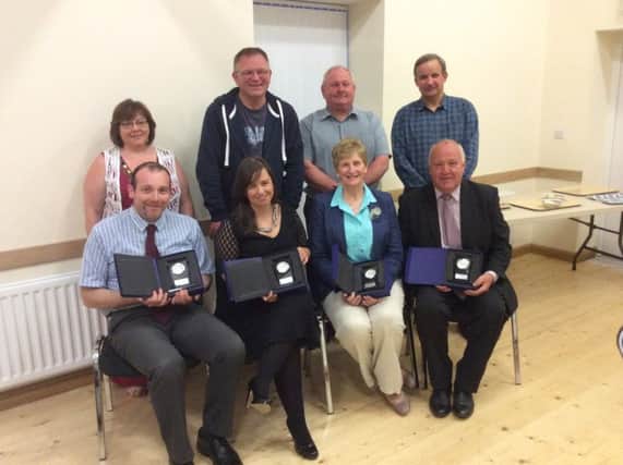 Local Councillors Paul Rankin, Hazel Gamble, Olive Mercer and Seamus Doyle receiving presentations from honoury KRCDA officers, in recognition of their contribution to the Kinallen Community.