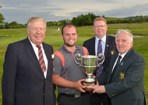John Ferriter (Chairman, Leinster Golf) presenting Jordan Hood (Galgorm Castle) with the 2015 Leinster Youths Amateur Open Championship trophy after his victory at Charlesland Golf Club today (17/06/2015). Also in the picture are Brendan O'Brien (President, Charlesland Golf Club) and Tony Fitzpatrick (Captain, Charlesland Golf Club). Picture by Pat Cashman