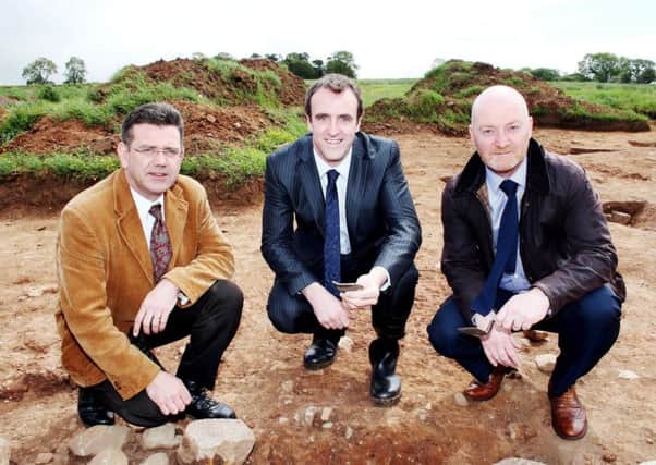 Principal Archaeologist Dr John O'Keeffe, Environment Minister Mark H Durkan and Tony McCance from Mid Ulster District Council at Tullaghoge in Cookstown in Co Tyrone, where the foundations of a house thought to belong to the Gaelic O'Hagan clan, some 700 years ago, have been uncovered.