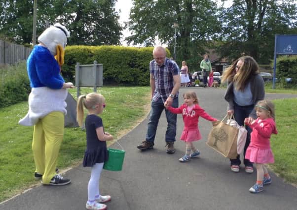 Donald Duck puts in an appearance at the Dromore Nursery School end of term Duck Race.