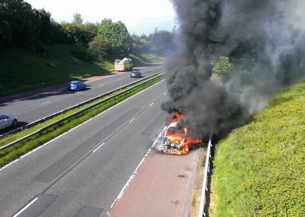 The care on fire on the M1.