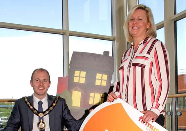 Lord Mayor of Armagh City, Banbridge and Craigavon Borough Council, Councillor Darryn Causby with Michelle Trainor of firmus energy at the launch of the home comfort grant scheme.