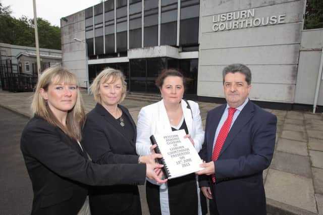 Solicitors Cherith Crymble, Ann Roulston and Janice Spence handing in a petition to keep Lisburn courthouse open to Ronnie Armour, chairman of the Courts and Tribunal Service. US1525-503cd  Picture: Cliff Donaldson