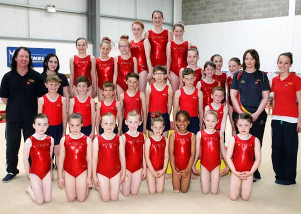 Intermediate members of Valdez Gymnastics Club pictured with coaches Christine Shannon, Chris Falls, Sarah Carr and Julie Vauls during Saturday's club championships. INBT26-266AC