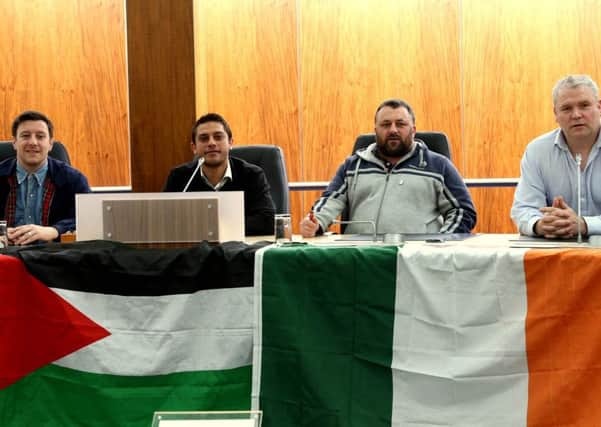 Councillors Darren OReiily, Gary Donnelly and Padraig McShane  with Mohammed Al-Halabi (second left) in Coleraine council chamber