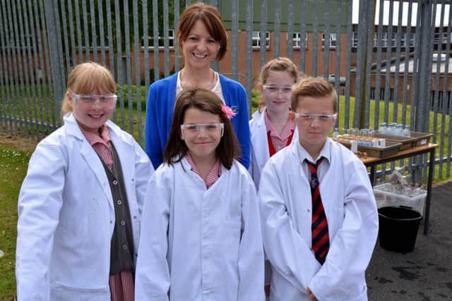 Miss Montgomery with Model Primary School pupils Paige, Casey and Bailey at Carrick Grammar School's P6 open morning. INCT 25-010-GR