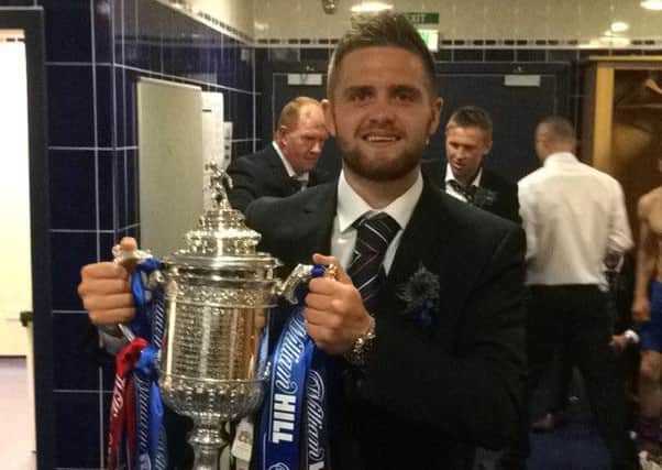 Local footballer Danny Devine enjoyed success in the Scottish Cup final with his side Inverness Caledonian Thistle. Devine, a former Lisburn Youth player, is pictured with the Cup. The defender has also signed a new one year contract with the Highland club.