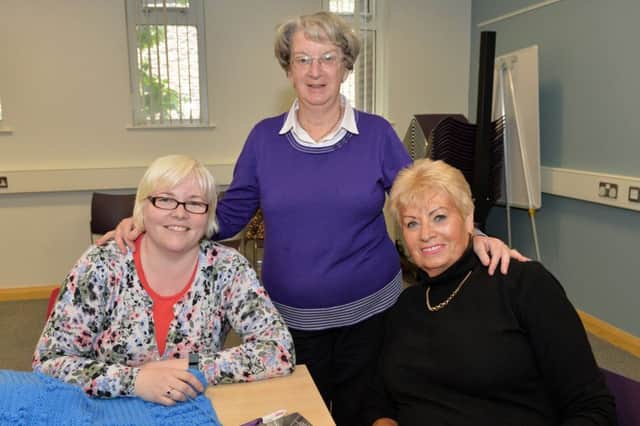 Members of the Knit and Knatter Club, Wendy Bradshaw, Iris McMurtry and Pat McCullough, at the Volunteer Now event in Carrickfergus Library. INCT 23-003-PSB