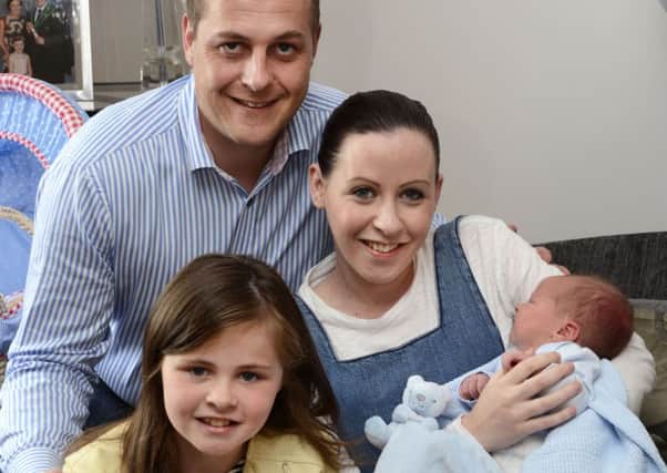 Graham, Kim and Katelyn Warke pictured with Ollie, the newest addition to the family. INLS2515-192KM
