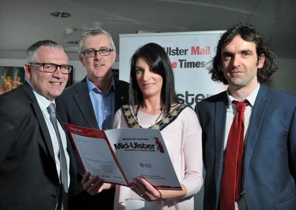 Mid-Ulster District Council Chairperson Linda Dillon who officially launched the 2015 Mid-Ulster Mail & Tyrone Times Mid-Ulster Business Awards held at the Burnavon last Thursday afternoon with the help of  Peter Bayne (North West Division Deputy Regional Editor), Brian MacAuley (Chief Executive Dungannon Enterprise Centre) and Michael McGlade (Multi-Media Content Editor).INMM2515-323
