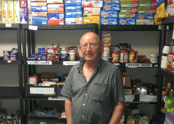 Alan Turner of Larne Foodbank pictured with some of the donated items stored at Craigyhill Mthodist Church.  INLT 29-680-CON