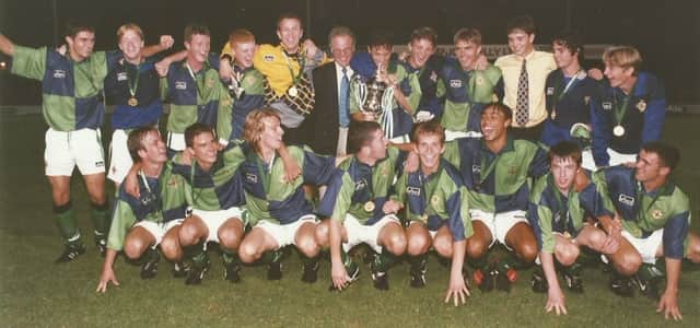 David Healy (kneeling, 2nd right) celebrates with the Northern Ireland squad after their 1997 Elite Milk Cup triumph.