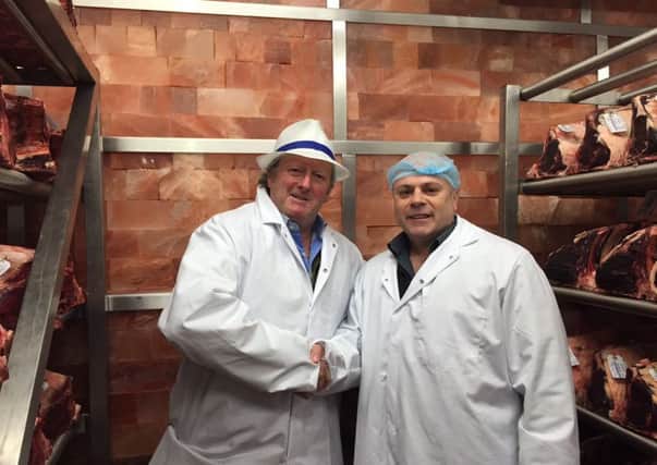 Charlie Lawson with one of the butchers at Hannan Meats Ltd.