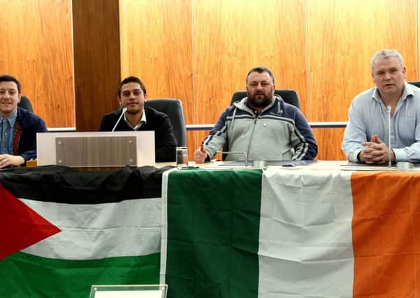 Cllr Padraig McShane in Cloonavin  with the Gaza representatives and the  Palestinian and Irish flags. inbm27-15