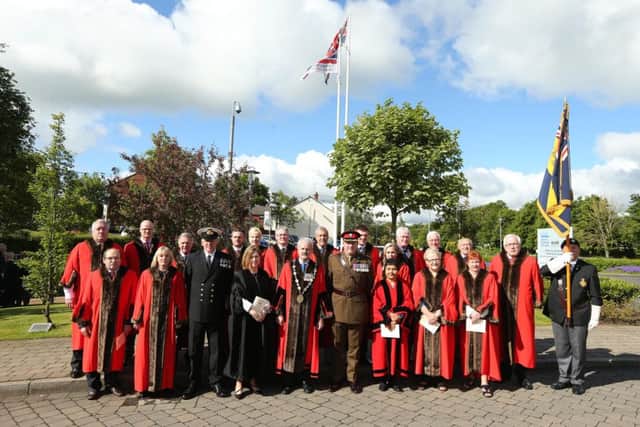 Pictured at Lagan Valley Island, Lisburn, where the Mayor, Cllr Thomas Beckett, raised a flag to mark Armed Forces Week with Elected Members of Council; Chief Executive, Dr Theresa Donaldson; Lieutenant Kerry Anderson, Royal Navy Reserves; Lieutenant Colonel Canon, Commanding Officer at Thiepval Barracks and the Royal British Legion in attendance.