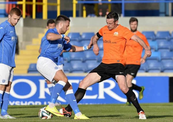 Glenavon's Ciaran Martyn  in action with St Johnstone's Brad McKay. 
Picture by Stephen Hamilton/ Presseye