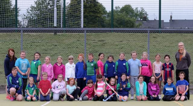 Young players who have been taking part in Ballymena Hockey Club's 'Play Hockey' scheme at Ballymena Showgrounds are seen here on the final night of the season with Coaches Becky Linford, Laura Logan and Joanne Logan. INBT 26-171CS