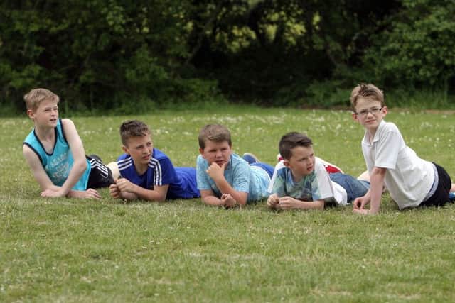 Boys from Creavery PS keeping an eye on the races at the schools annual sports day. INAT25-414AC