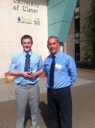 Charlie Monaghan is congratulated on his Sentinus NI Young Engineer of the Year by Head of Technology and Design Mr Robert Barton.