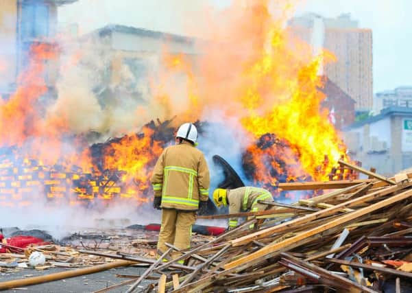 Fire crew at Sandy Row Bonfire after it was set alight early