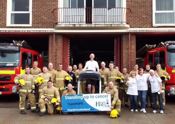 Northern Ireland Fire and Rescue Service operational firefighters, support staff and representatives from Hope House charity in Whitehead, celebrate raising £8,050 following the recent 26Hour Treadmill Challenge held at Cadogan Fire Station. INCT 26-753-CON