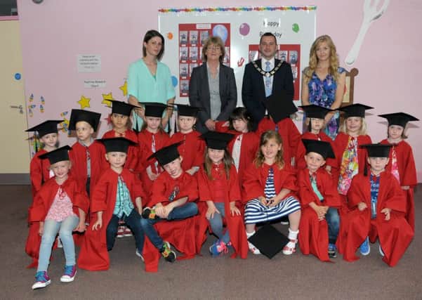 Kids from Woodburn Playgroup at their graduation ceremony with Mid and East Antrim Borough Councils deputy mayor, Councillor Timothy Gaston and playgroup leaders. INCT 25-208-AM