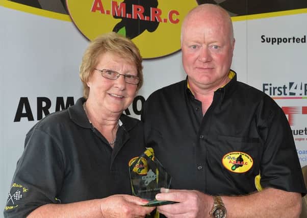 The Armoy Motorcycle Road Racing Club this week paid tribute to a founding member of the Club, Kathleen Hartin, by awarding her an Honorary Membership at the launch of the 2015 Armoy Road Races. Kathleen Hartin, receiver of the Honorary Membership Award at the Armoy Road Races Launch 2015, pictured with William Munnis, Chairman of the Armoy Road Racing Motorcycle Club.