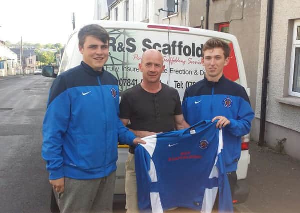 Robert Wright of R&S Scaffolding presents Southside Rangers FC players Sam McNiece and Ryan Corrigan with matchday sweatshirts for the new season.