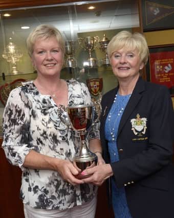 Lorna Poots presented Lady Captain's Day winner Fionnuala Crossey  with her cup ©Edward Byrne Photography INBL1526-294EB
