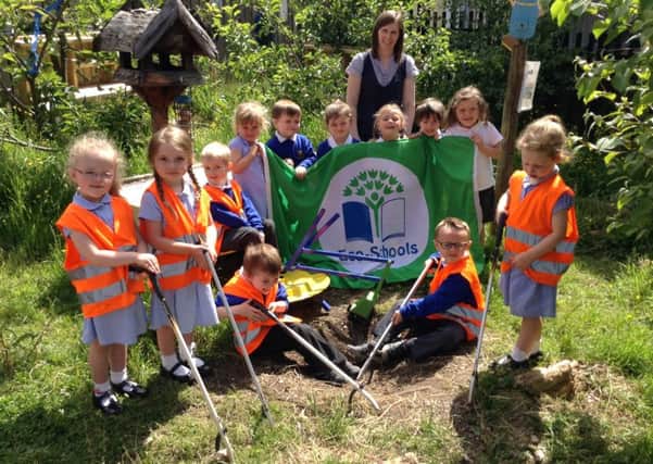 Chuildren from Dromore Nursery School with their third Green Flag.