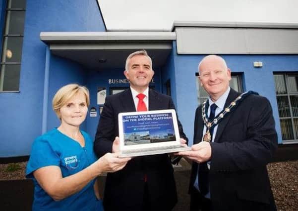Leigh Hannah of Growing Smiles is pictured at LEDCOM's Willowbank Business Park in Larne with DETI Minister Jonathan Bell and Cllr Billy Ashe, Mayor of Mid East Antrim.  INLT 26-677-CON