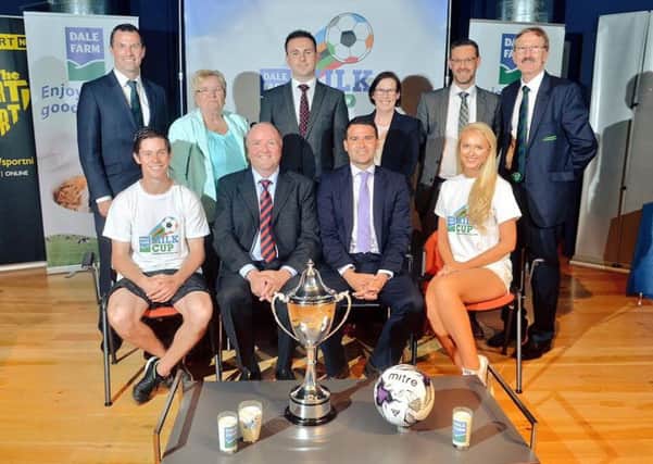 Councillor Andrew Wilson (back row, centre) and other members of staff from Mid and East Antrim Council, along with former NI player David Healy and Miss Northern Ireland Leanne McDowell.  INCT 27-724-CON