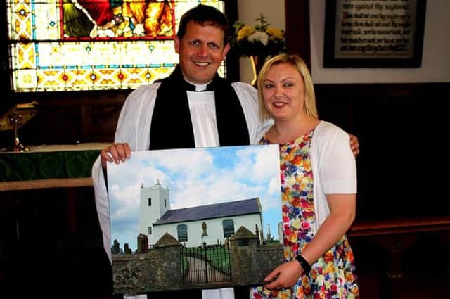Rev Patrick Barton presents Ruth with a photograph of the church. inbm28015 s