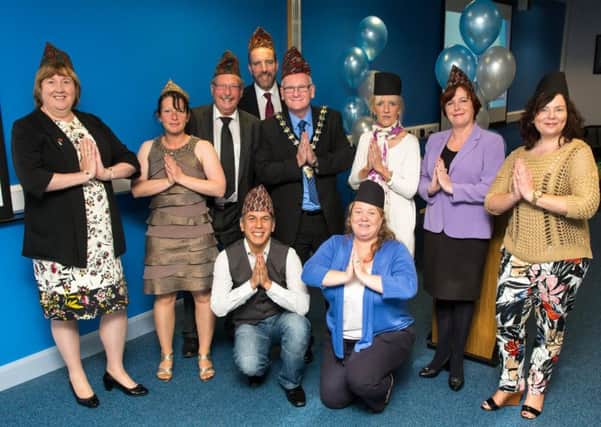 Ledcom staff , Alderman Maureen Morrow and Mayor of Mid and East Antrim Borough Council Billy Ashe join Rishi Kunwar and Jane Prendy (front row) in supporting the Hats off for Nepal social media campaign. INLT-26-717-con
