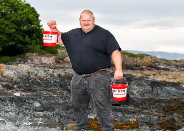 Former UK and Europes Strongest Man Glenn Ross takes 'Giant Steps' to help launch the Action Cancer Giants Walk taking place on Saturday 5 September the picturesque walk follows a stunning route along the Causeway coastal paths. (Submitted Picture)