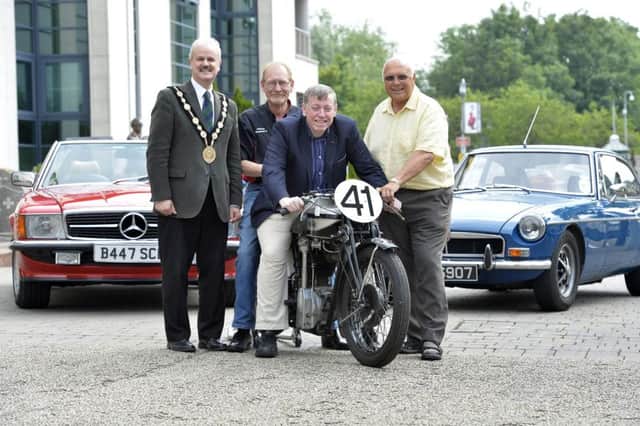 Pictured at the launch of the 3rd August UGP Bike Week event being held at Lagan Valley LeisurePlex are: (l-r) the Mayor, Councillor Thomas Beckett; Ken Stewart, Secretary of Dundrod and District Motorcycle Club; Alderman Paul Porter, Chairman of the Council's Leisure & Community Development Committee and Sammy Spence, Chairman of Lisburn City Old Vehicle Club.  The motorcycle in the photo was ridden at the UGP by former road racer Anges Martin.