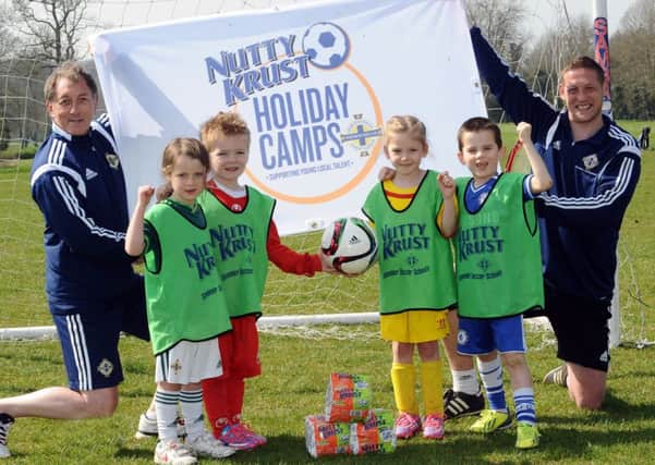 Ken Duncan, Irish FA Regional Grassroots Development Officer and Kris Lindsay, Irish FA Primary School Coach, help promote the Nutty Krust Summer Holiday Camps. INLT 27-996-CON